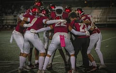 Grizzlies Huddle And Prepare For Victory Against Torrey Pines 10/14/22 Pink Out Game