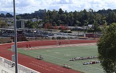 A P.E. class gathers on the Mission Hills football field