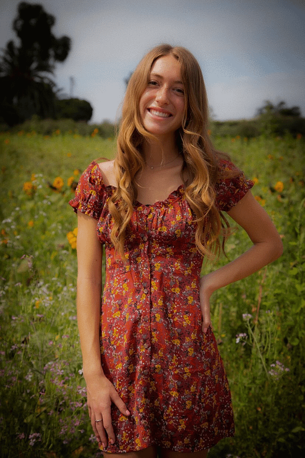 Smiling+girl+standing+in+field